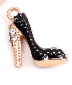 Black high-heeled shoe charm with gold accents on a white background