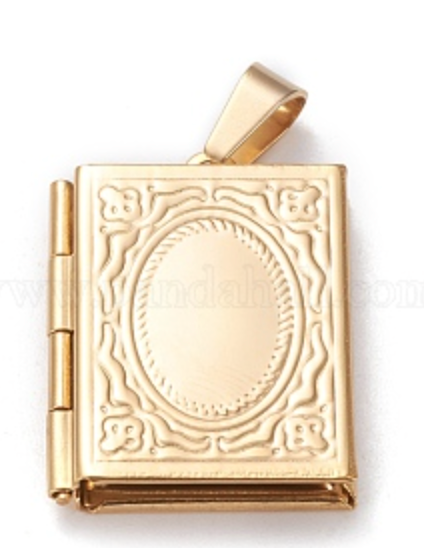 Gold book-shaped locket charm with intricate designs on a white background