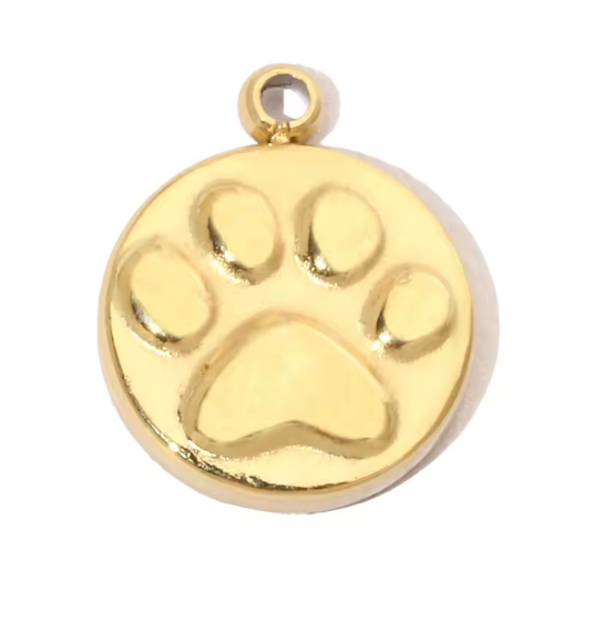Gold charm with a paw print design on a white background