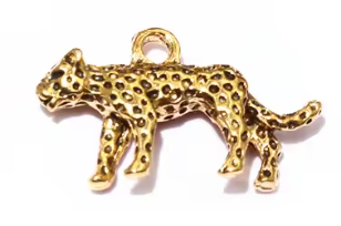 Gold leopard charm on a white background
