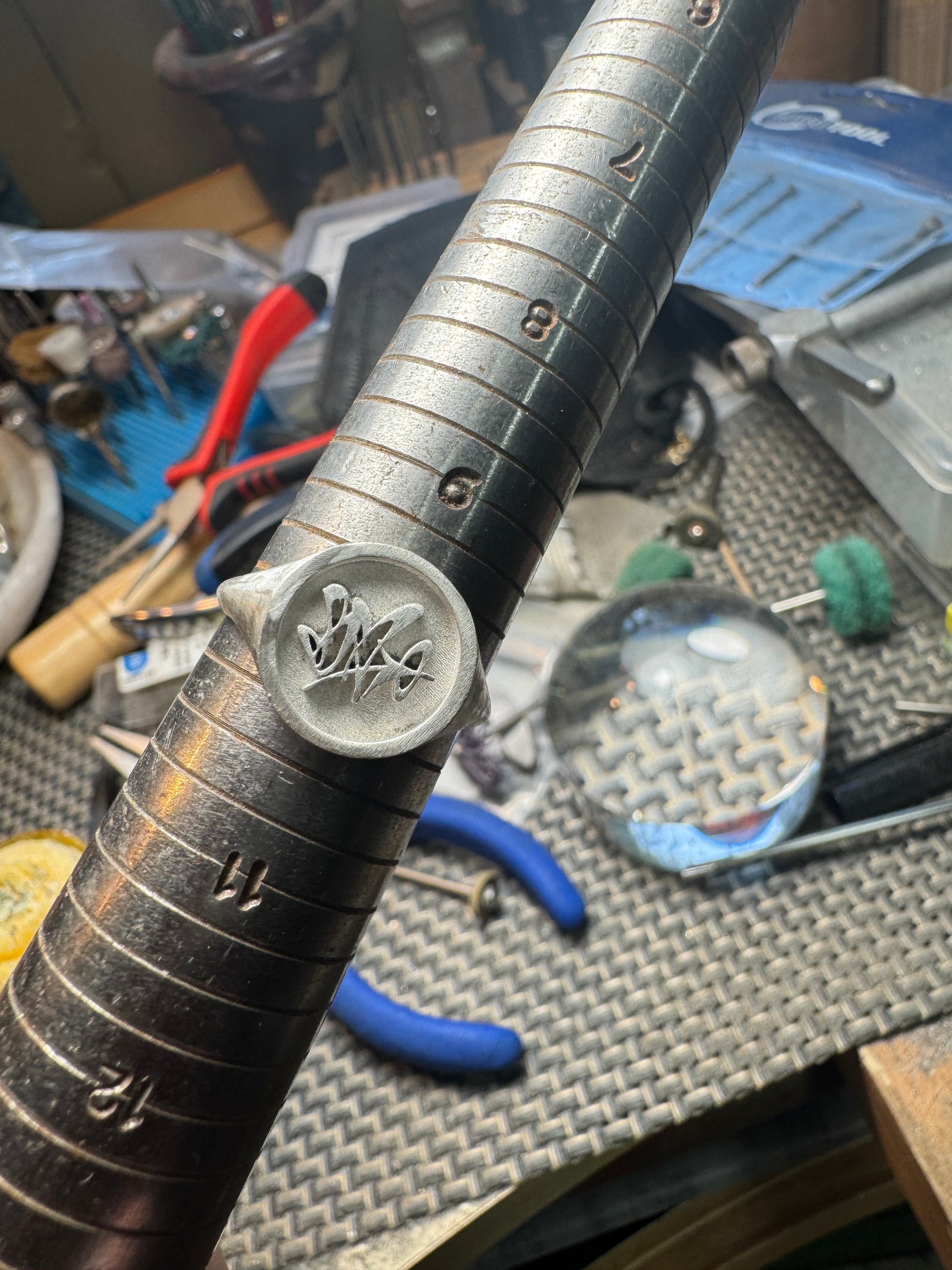 Custom ring in progress on jewelers bench