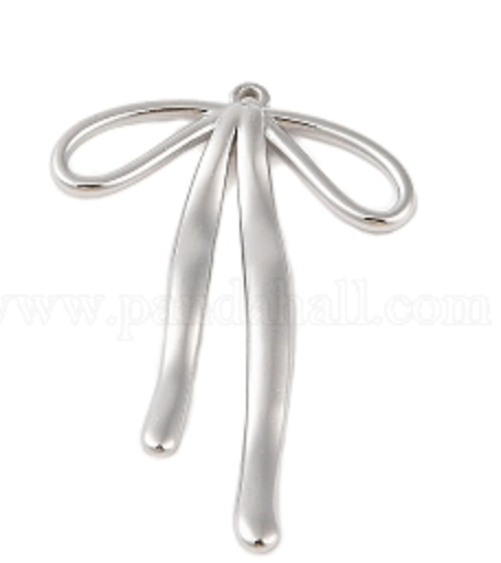 Silver Bow shaped charm on a white background