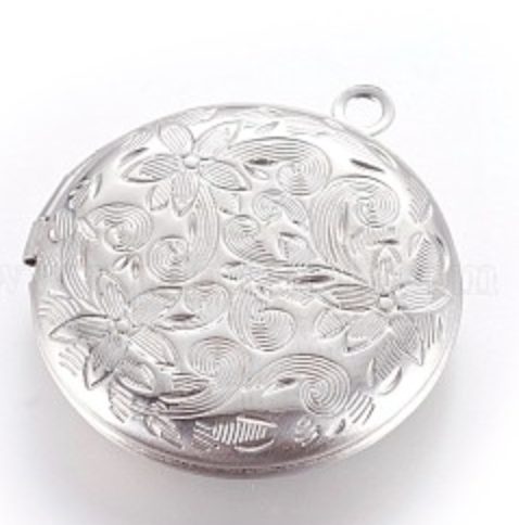 Silver floral locket on a white background