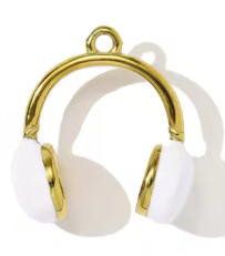 White headphones with gold accents charm on a white background